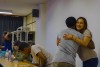Two Hub researchers from the Ethiopia and Colombia teams embrace in a friendly hug thumbnail